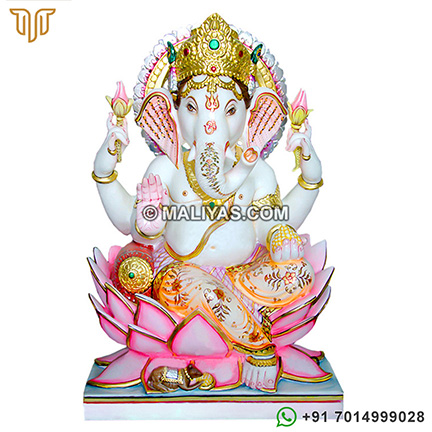 marble ganesh statue sitting on lotus